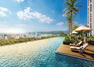 A luxurious infinity pool with palm trees, sun loungers, and panoramic city views in a serene setting.